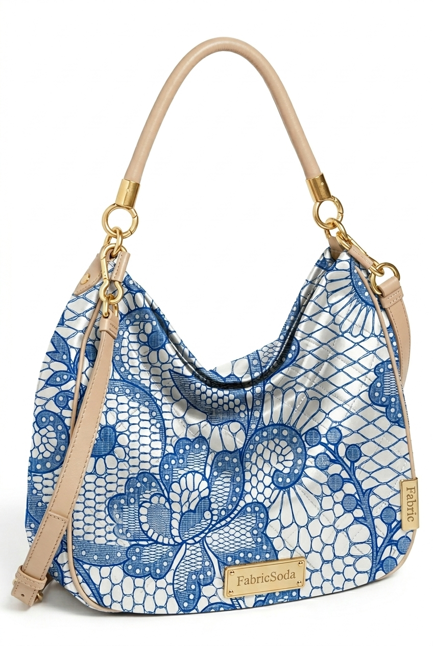 Handbag with blue floral lace pattern on a white background